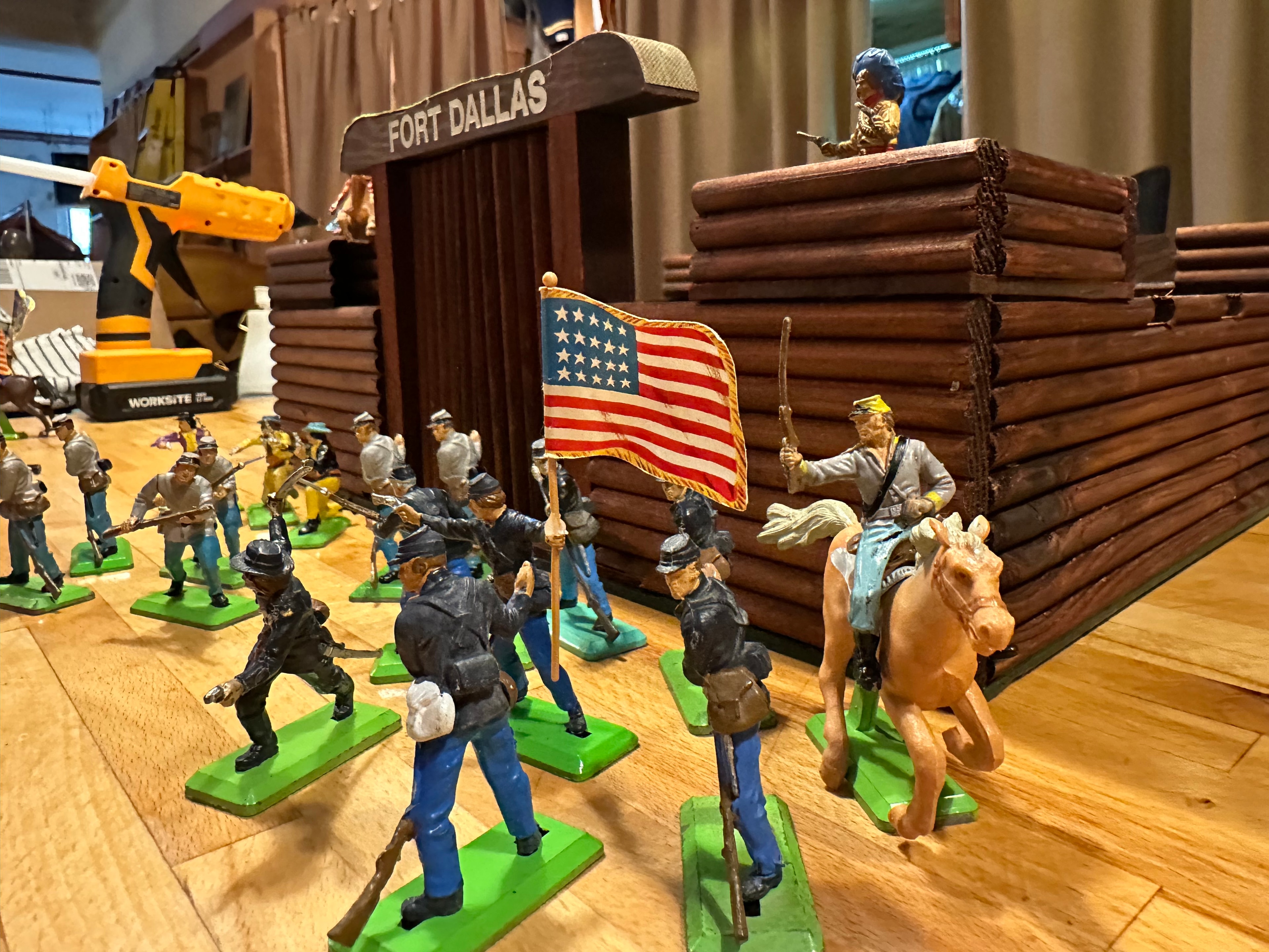 Vintage Britains Deetail Civil War figures with Union soldiers and American flag displayed on wooden Fort Dallas log fort