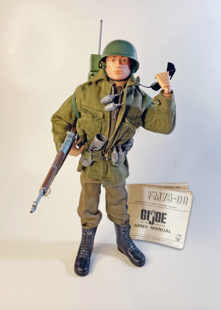 1970s GI Joe Action Soldier fully equipped with helmet, radio backpack, rifle, grenades, dog tags and Army Manual