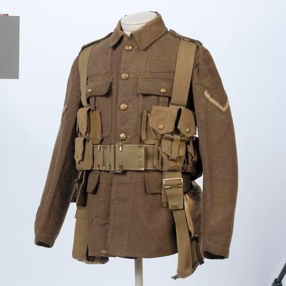 WWII British Army service tunic with webbing belt and ammunition pouches