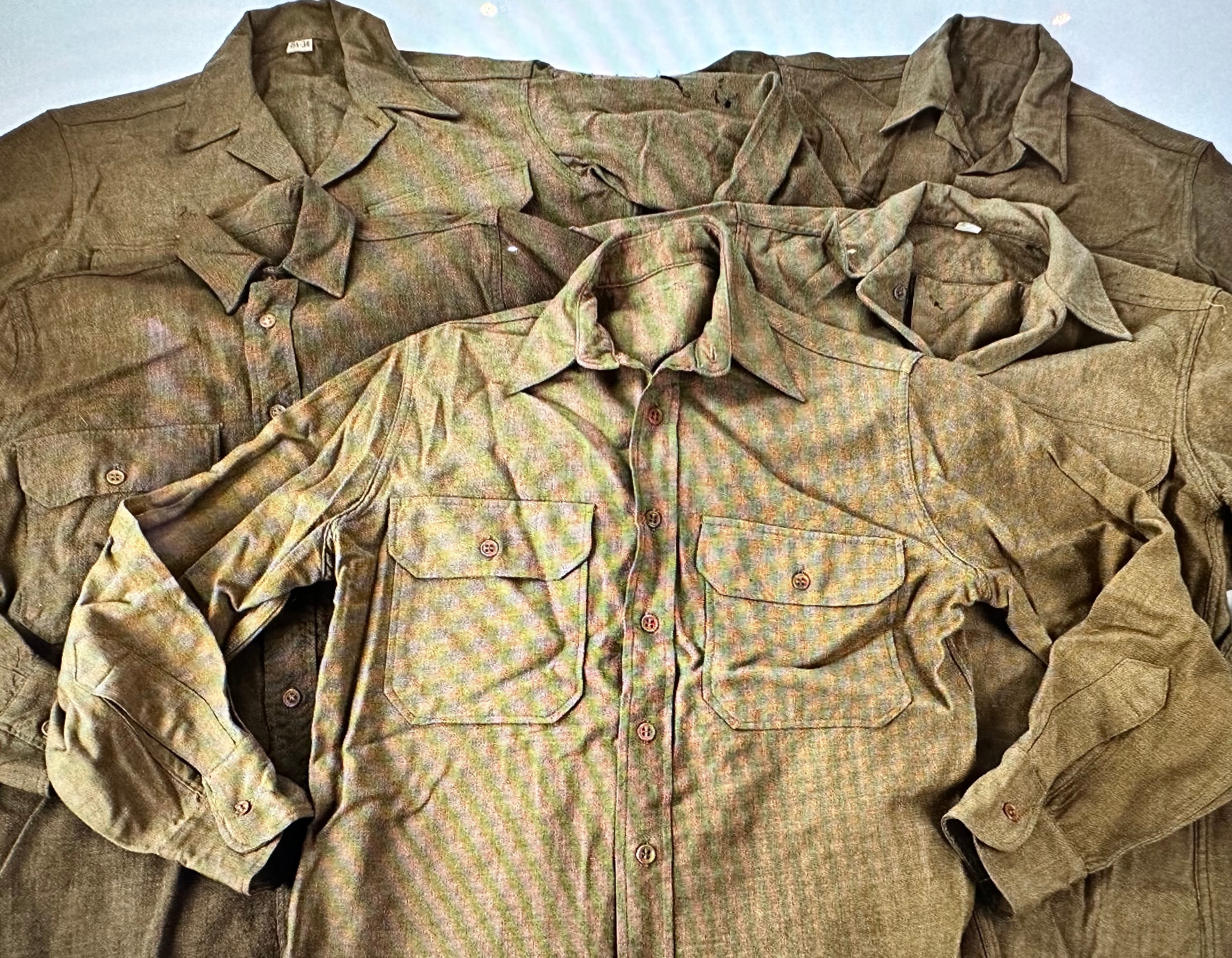 WWII US Army HBT herringbone twill fatigue shirts in olive drab camouflage pattern, multiple sizes